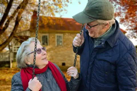 Senior couple sharing a tender moment at home, showcasing the benefits of companionship care