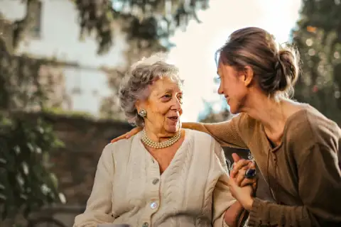 Mother and daughter sharing a joyful moment at home, showcasing the positive impact of professional home care support